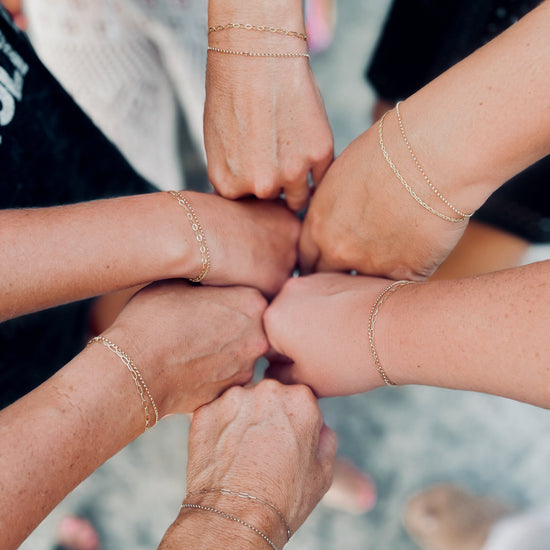 Friends with stacked permanent jewelry bracelets private party